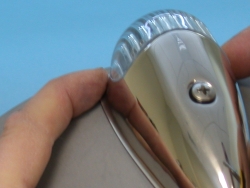 Install screw and center marker light on bucket before tightening.